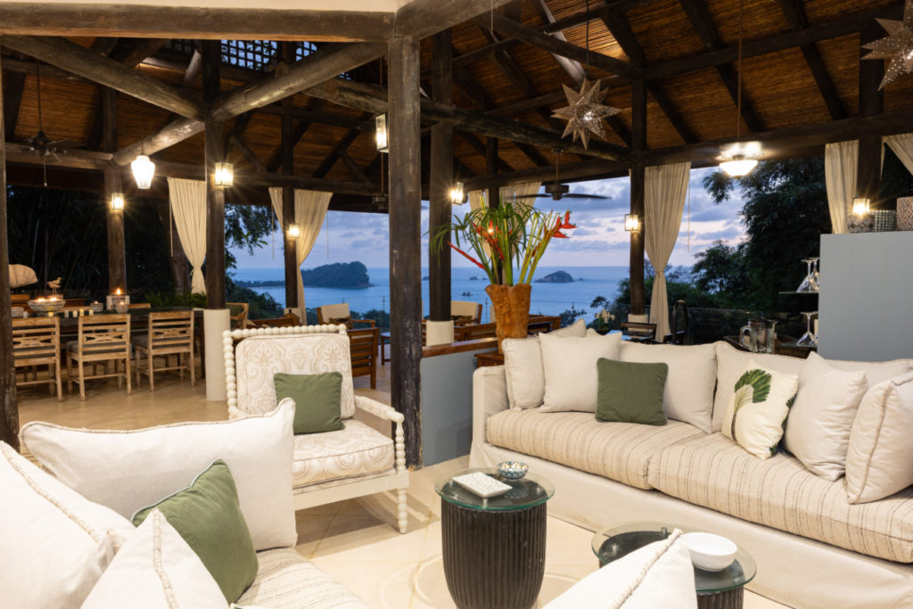 Immerse yourself in open-design living, featuring elegant furniture and stunning ocean views of Manuel Antonio.