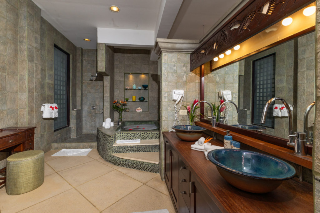 Treat yourself to the opulence of this spacious, elegant bathroom, complete with all the amenities for ultimate luxury, including a bathtub, double sinks, and a generous shower space.