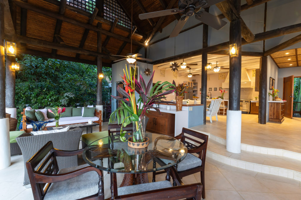 This villa features a spacious lounge and living area, enhanced by ocean breezes and ceiling fans.