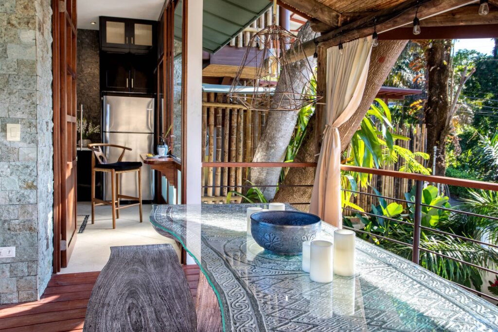 This open-air dining space flows naturally into the kitchen, creating an easy, elegant setting for shared meals and relaxed family time.