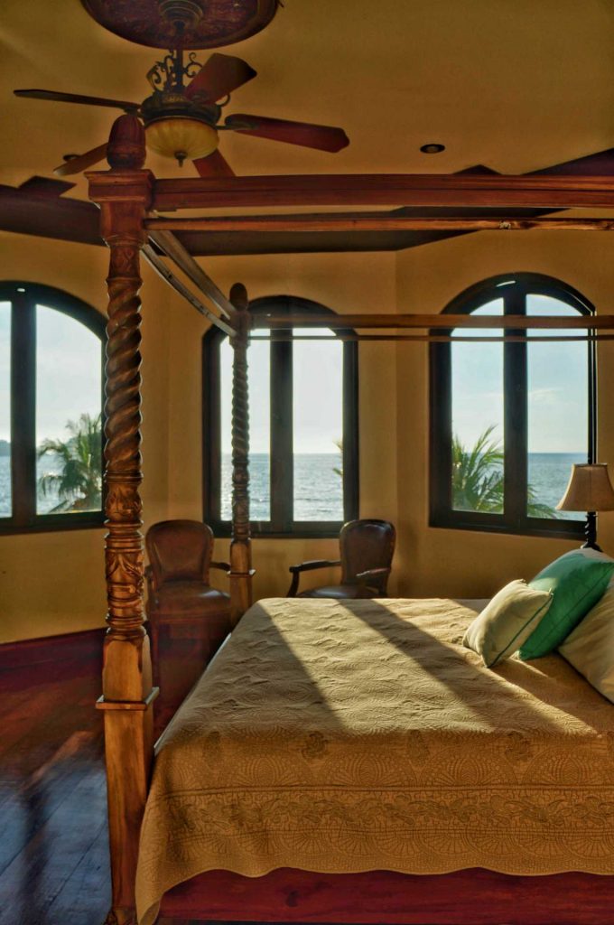 This king poster bed is the focal point of one of the 3 master bedrooms. Wake up to a panoramic ocean view each morning at this mansion villa in Playa Flamingo. 