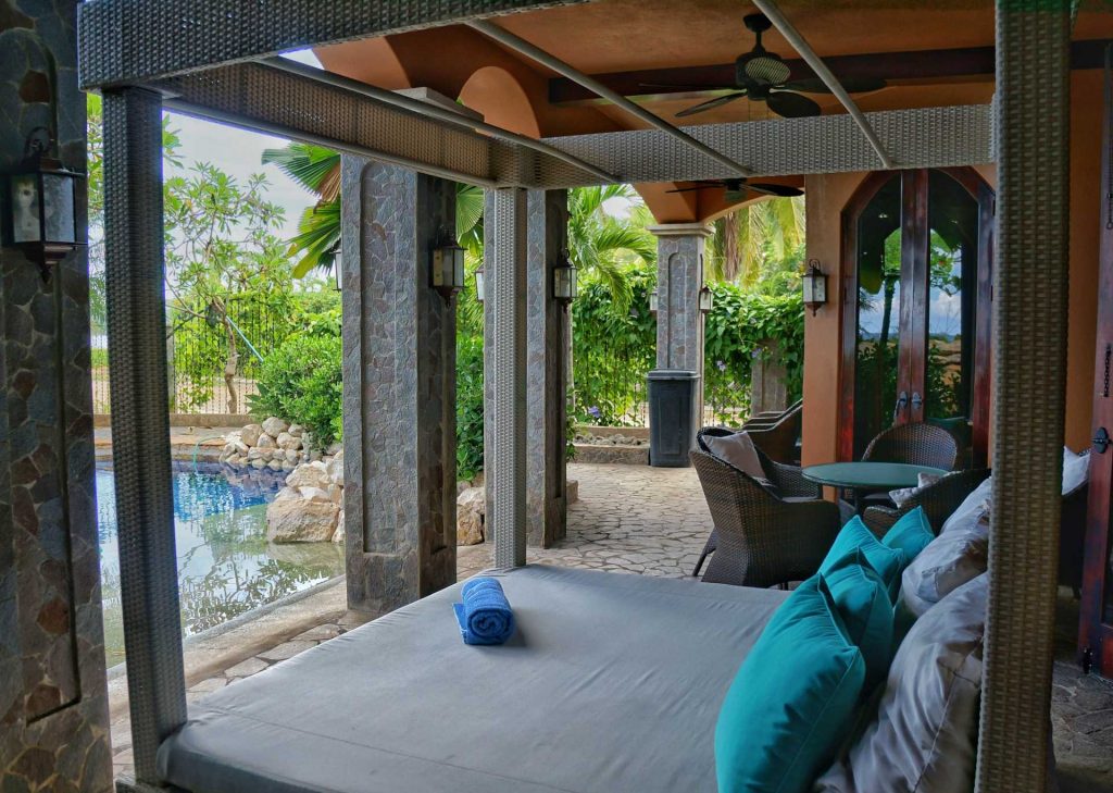 Take a nap or just relax on this unique lounging bed poolside. This luxurious villa rental in Playa Flamingo has all the amenities you need for a perfect Costa Rican vacation. 