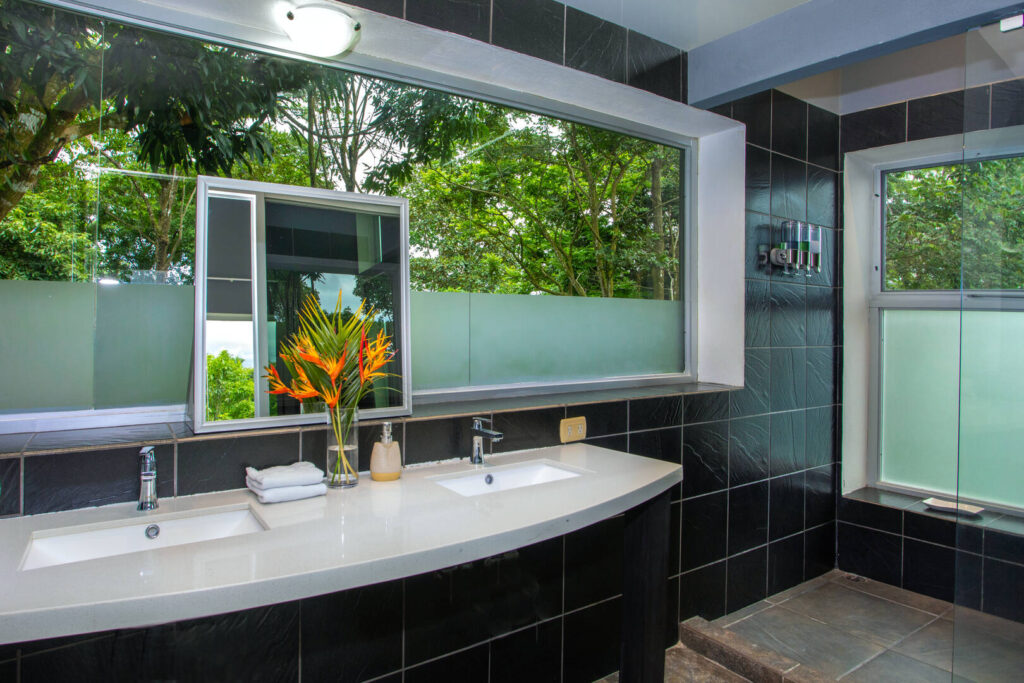 Get ready for your night out in Manuel Antonio surrounded by lush rainforest in this stunning bathroom.