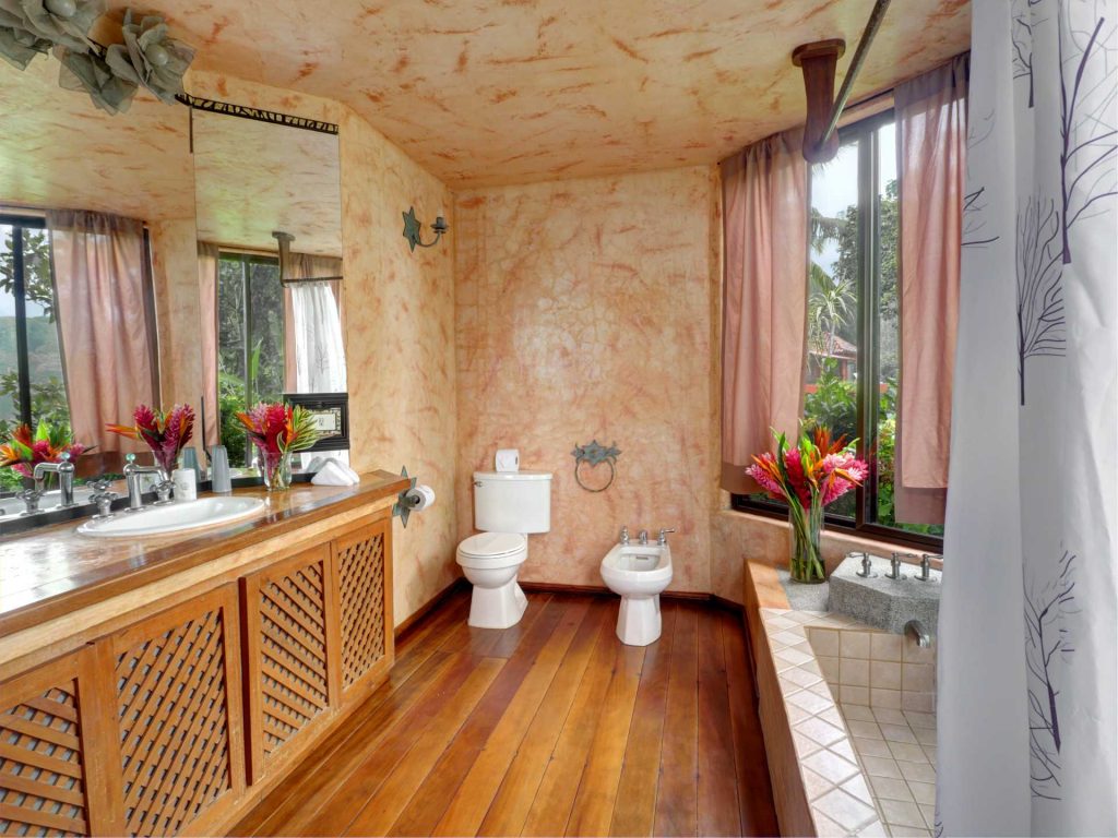 The ensuite of the master bedroom has a large bath for you to soak and soothe after an adventurous day.