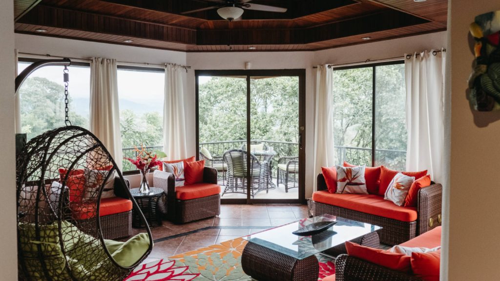 The living room has been redecorated in a fun tropical style and the views create a stunning jungle setting. 