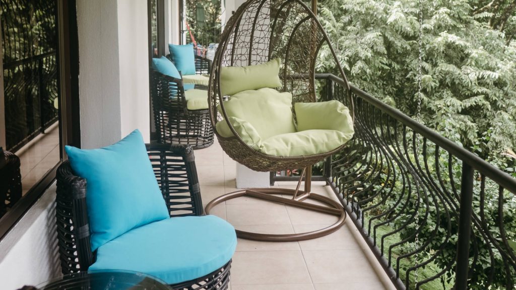 All three levels have spacious balconies to relax on and this hanging chair is a unique addition. 