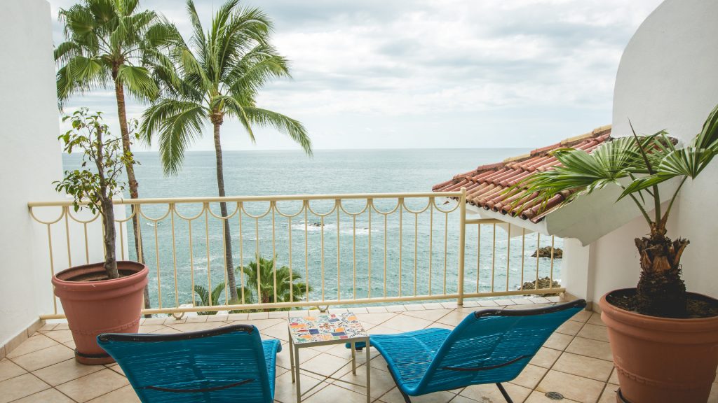 This balcony sitting area has several lounge chairs for you and your spouse to enjoy. 