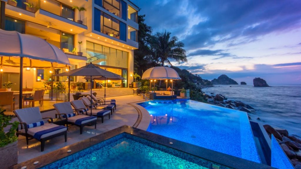Take a midnight dip in the blue pool while enjoying an ocean breeze rolling in. 