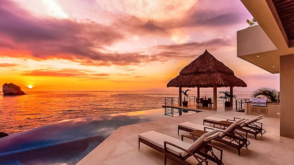 Relax by the pool with a drink and enjoy the sunset.