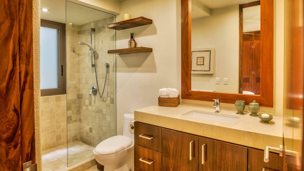 This bathroom has a large standup shower and all amenities you might need. 