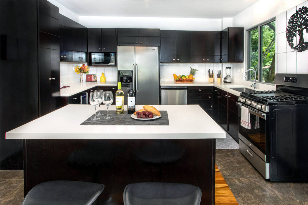 The kitchen has modern high-end appliances and a view to enjoy while you use them!