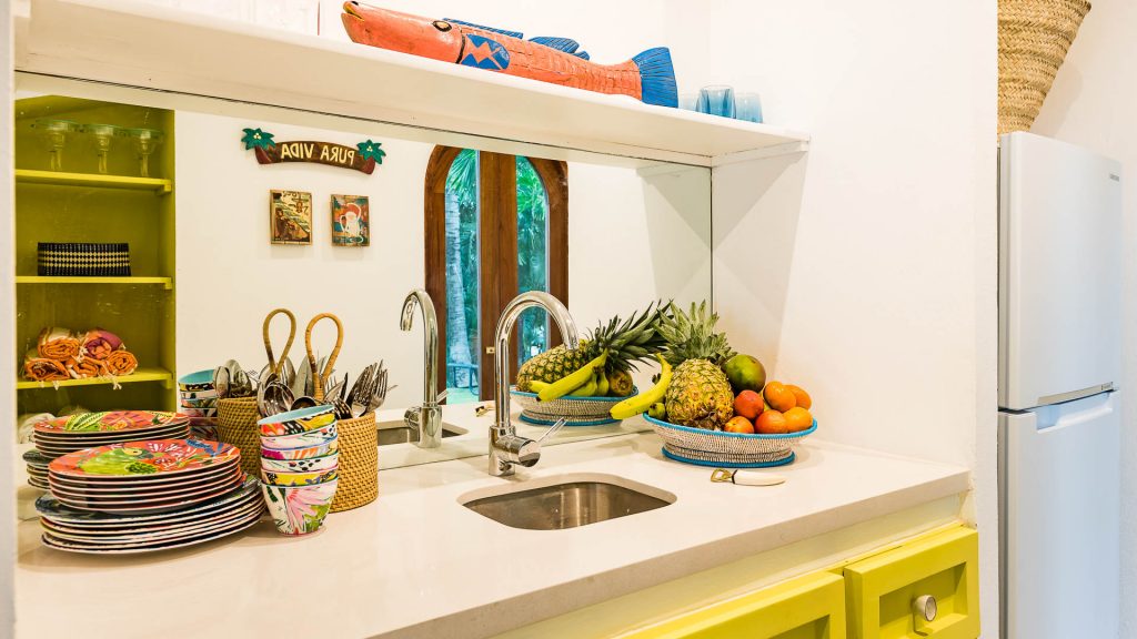 A colorful little side kitchen for prepping fruit and vegetables.