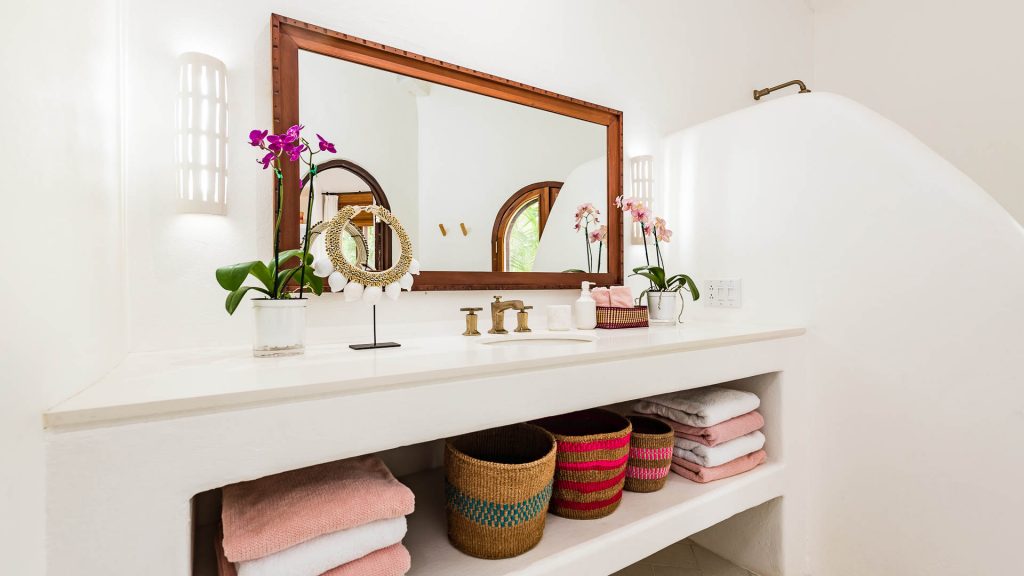 This bathroom is very cleanly and comes with a full-size mirror and large counter.