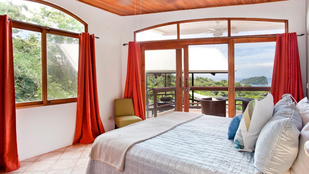 This large king master bedroom has a balcony and an ensuite bathroom, all with amazing ocean views.