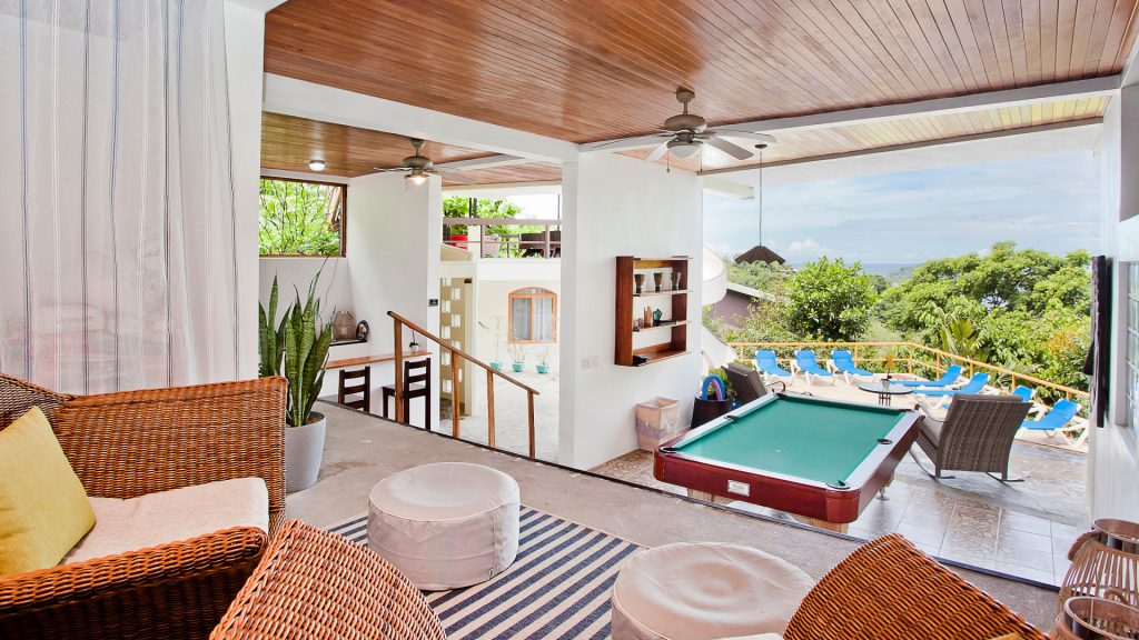 The layout of the villa is genius. From this sitting area look down on the entertainment area, pool, and stunning views.
