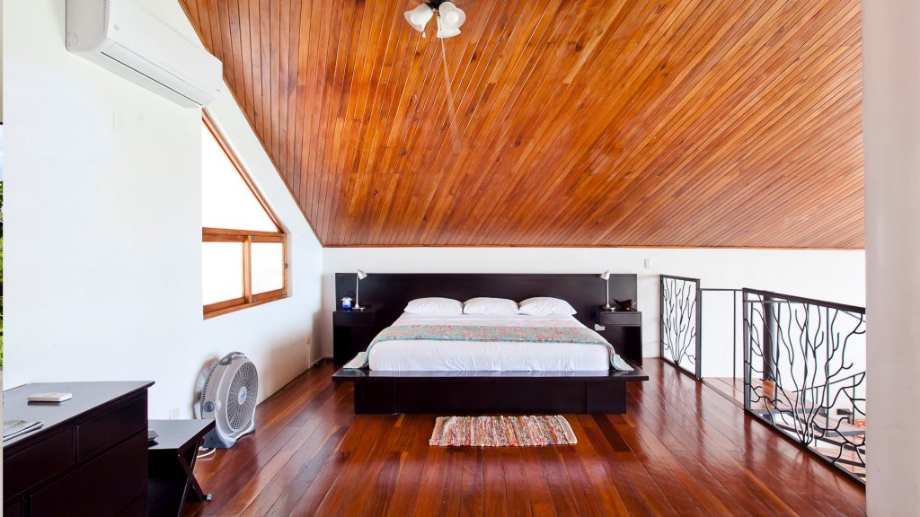 The loft bedroom is extremely spacious with a beautifully-designed king bed.