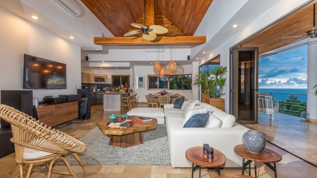 The open-concept living area is made even more open with the sliding doors pushed back to let in the fresh ocean breeze.