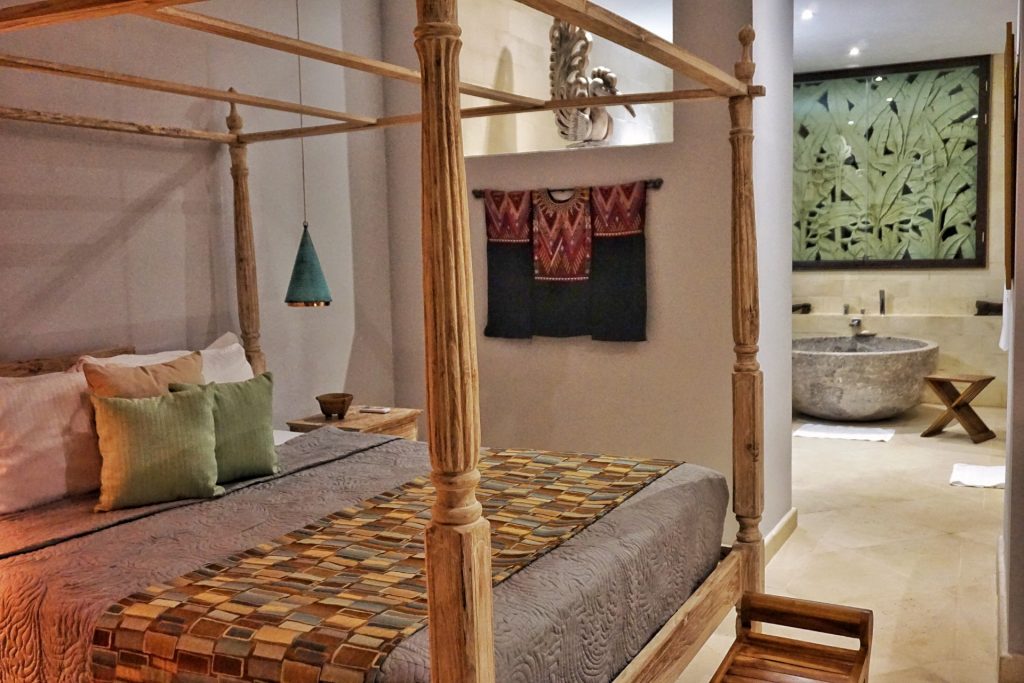 This bedroom features a beautiful hand-carved king poster bed. The villa has more than a touch of class throughout. 