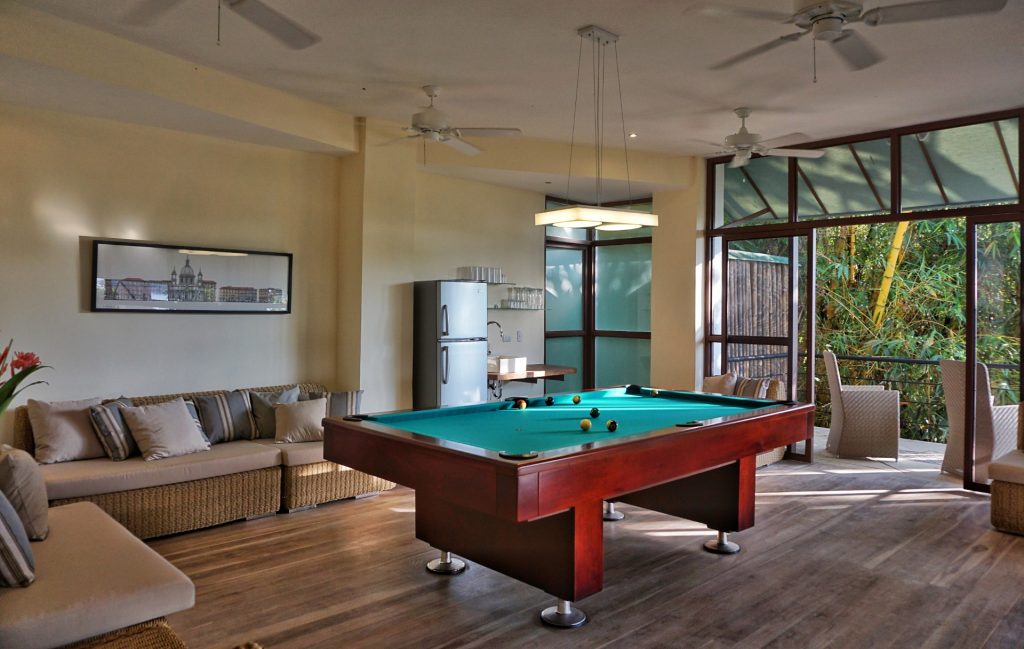 The games room at this Manuel Antonio vacation home has a regulation pool table and wet bar with refrigerator.