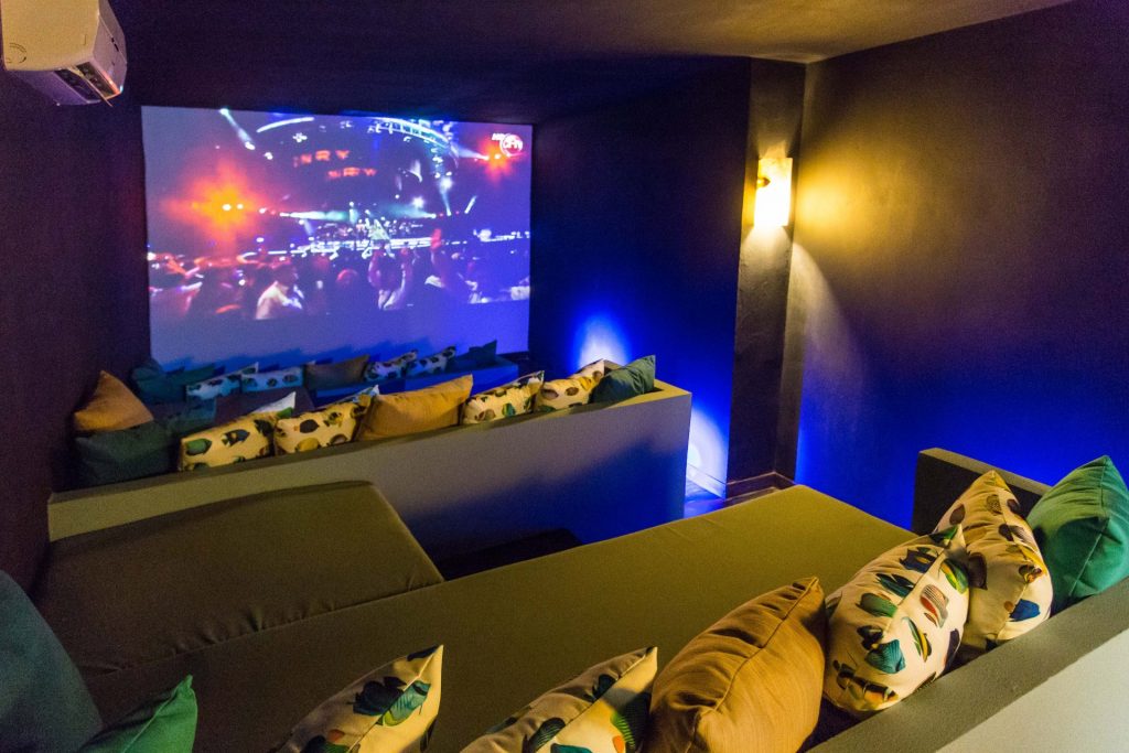 Enjoy a private movie night in the theater room. The huge screen is easily seen from the tiered seating area.