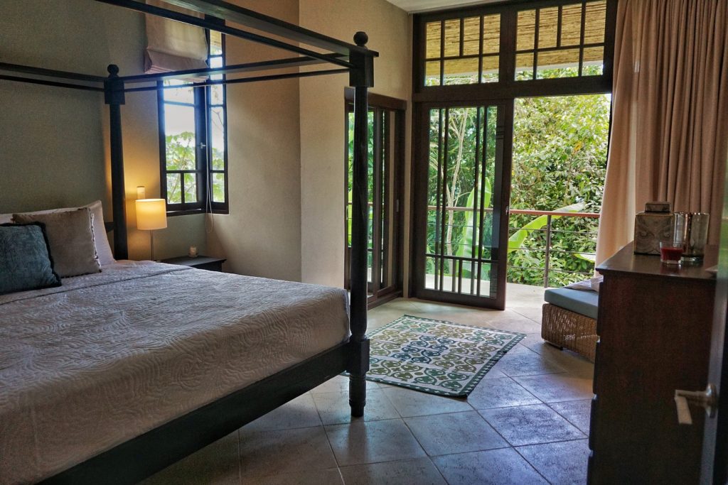 Wake up to beautiful natural light and the sounds of the rainforest in this wonderfully-furnished bedroom.