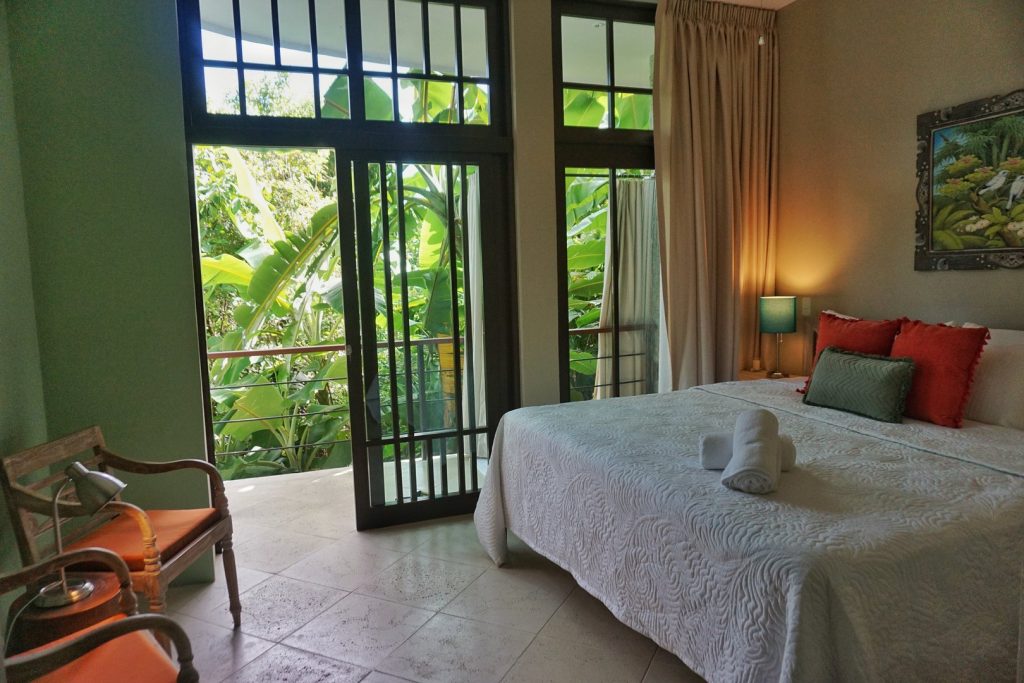 This bedroom has a private walkout porch for you to watch for wildlife in the jungle.