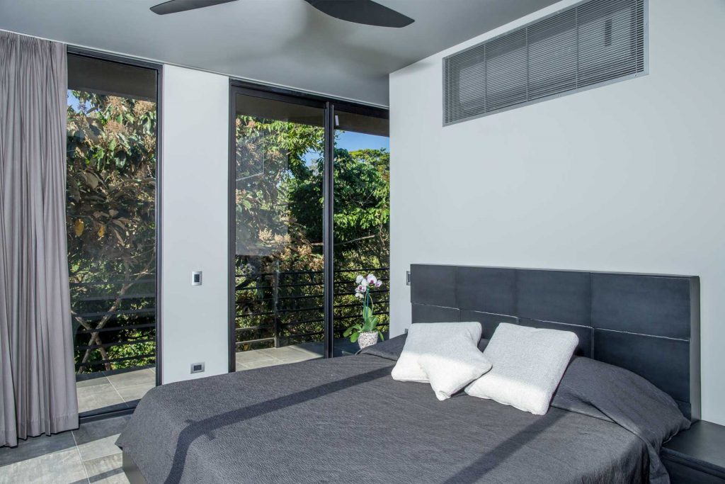 This incredible king bedroom displays the open design of the villa that gives you an incredible rainforest living experience.