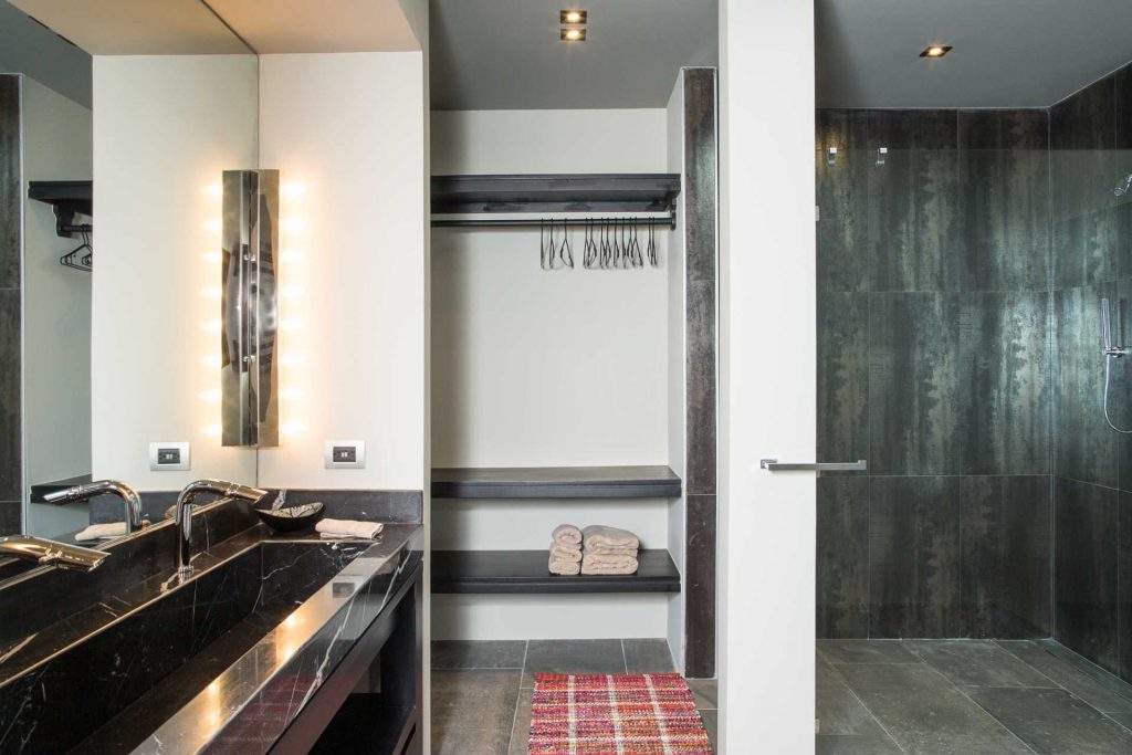 Dual sinks of granite are featured in this beautifully-designed ensuite bathroom.