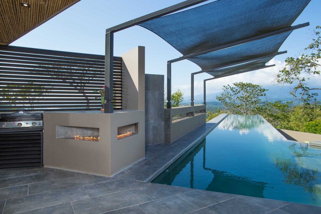 The unique gas fire pit runs almost the entire length of the pool. A relaxing evening is waiting for you at this villa.