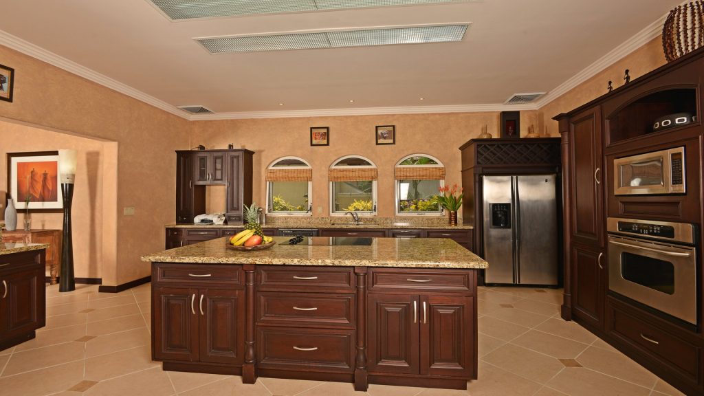 This spacious modern gourmet kitchen with high-end appliances is a dream for any chef.