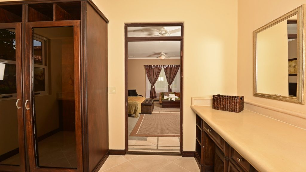 The quality wooden furniture and cabinets add a grand feel to the bathrooms.