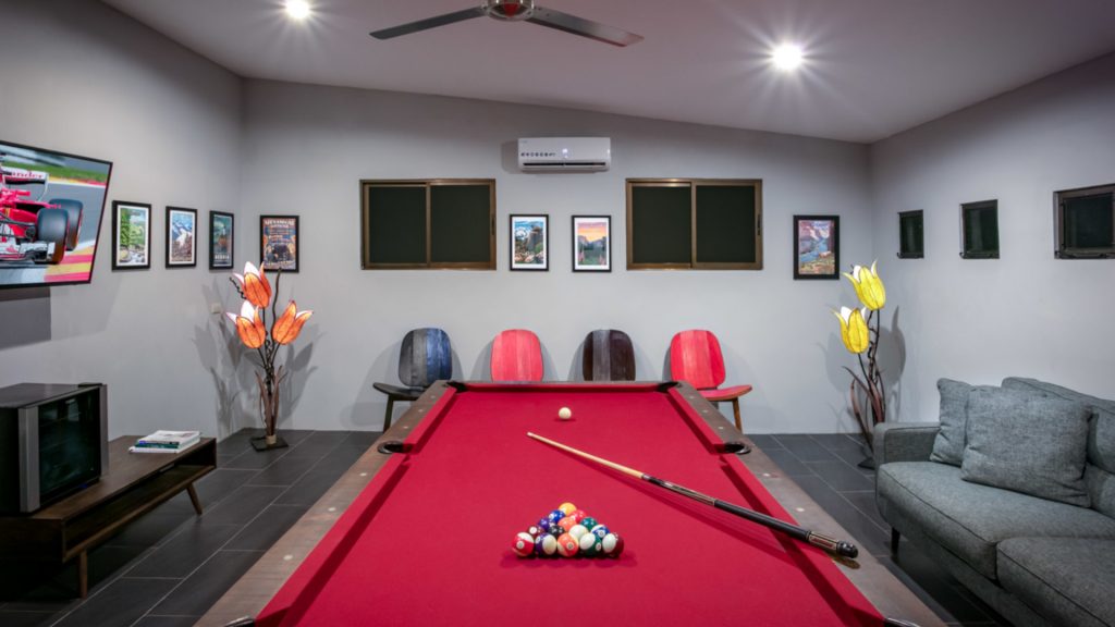 Enjoy some pool in the air-conditioned games room with your family. There is a large screen TV and comfortable seating. 