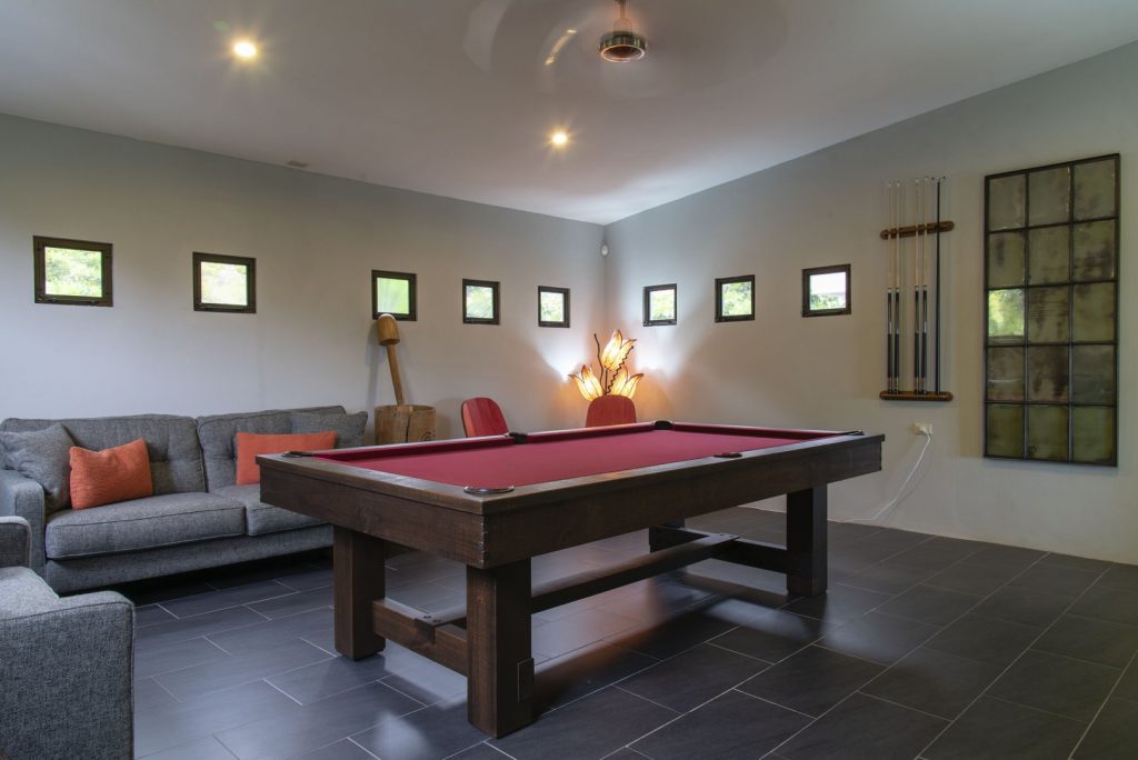 The gorgeous wooden pool table in the air-conditioned games room. 