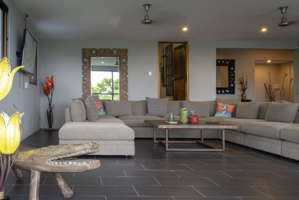 The massive living room has plenty of comfortable seating where your family can relax after an adventurous day.