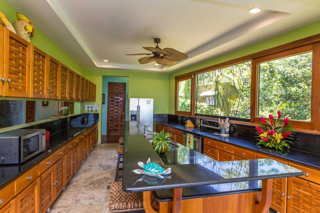 The perfectly-designed kitchen with granite counters provides a great place for preparing meals for your group.