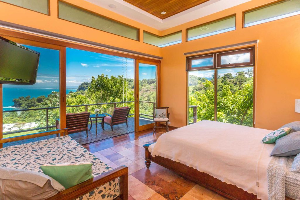 The master suite has a private balcony, ensuite bathroom, a king and a twin bed, and a spectacular ocean view.