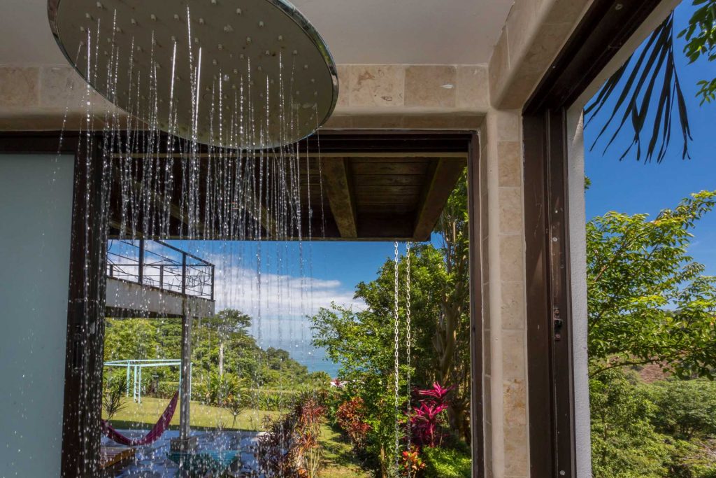 This tropical rain shower opens up to the gorgeous surroundings of the rainforest. 