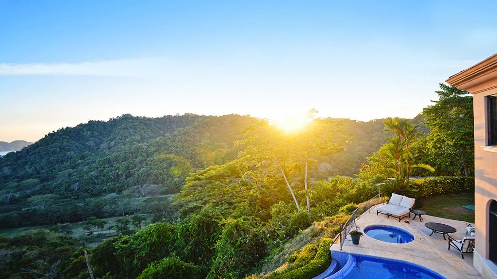 Beautiful sunset while overlooking the hillside in the pool or jacuzzi can be enjoyed at JA-18
