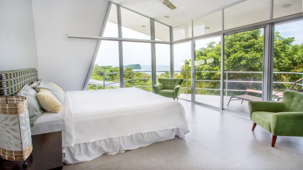 Roll up the shades each morning and enjoy this gorgeous ocean view from the master bedroom at this amazing vacation home in Manuel Antonio.