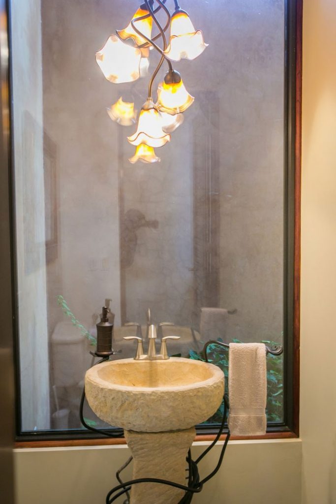 The artistic attention to detail in this home is phenomenal even in the bathrooms. This natural stone sink is beautiful.
