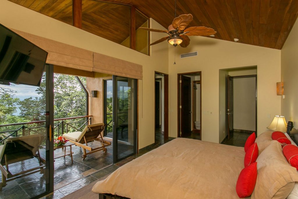 High vaulted wooden ceilings and huge glass doors opening to your private balcony. This bedroom is pure heaven.