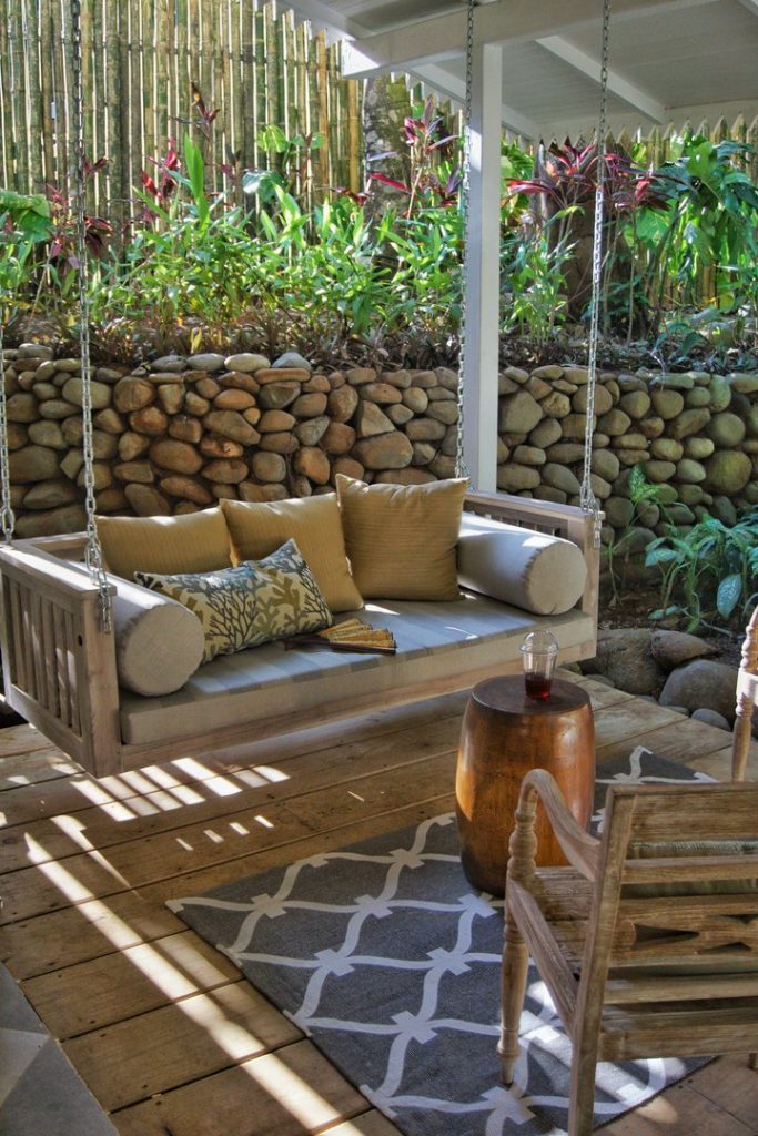 The porch swing is reminiscent of times gone by but in a modern tropical setting. 