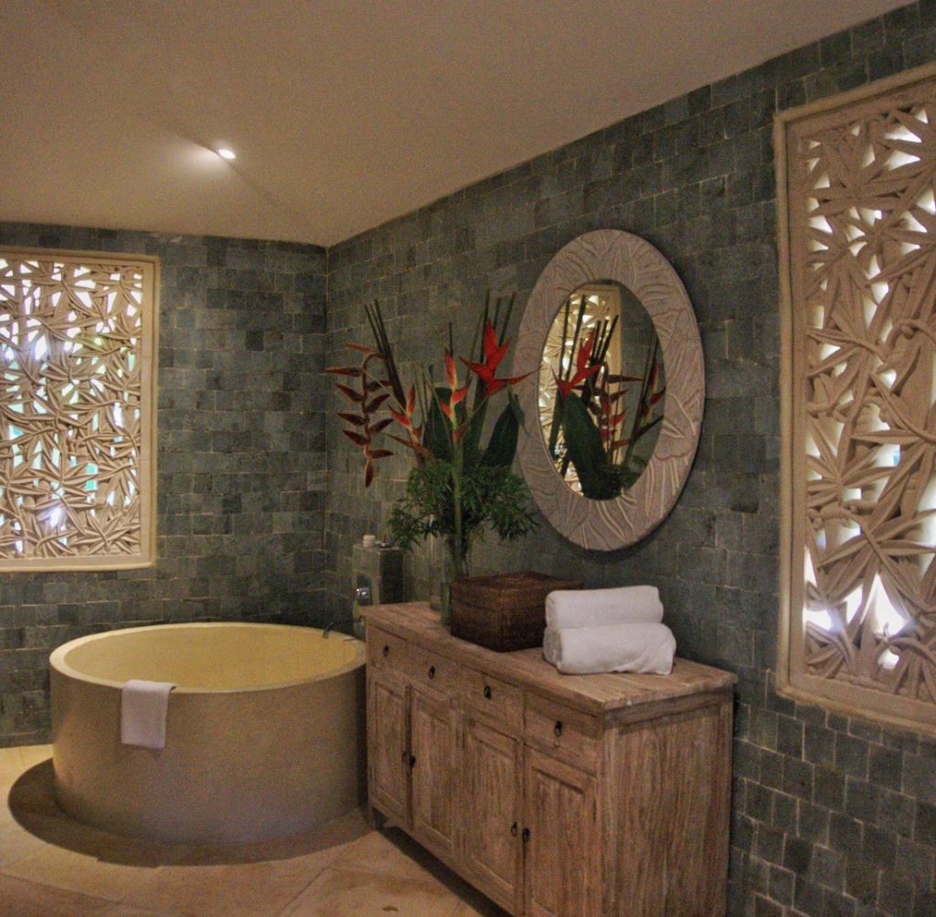 The designer has created an incredible atmosphere in the master bathroom. 