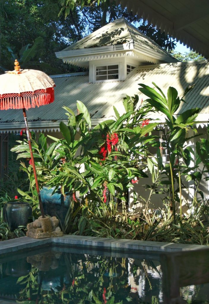 The tropical garden adds beauty and tranquility to this secluded property just a short walk from the bus. 