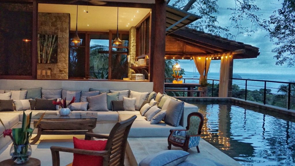 Sit outside on this large comfy couch with your family. 
