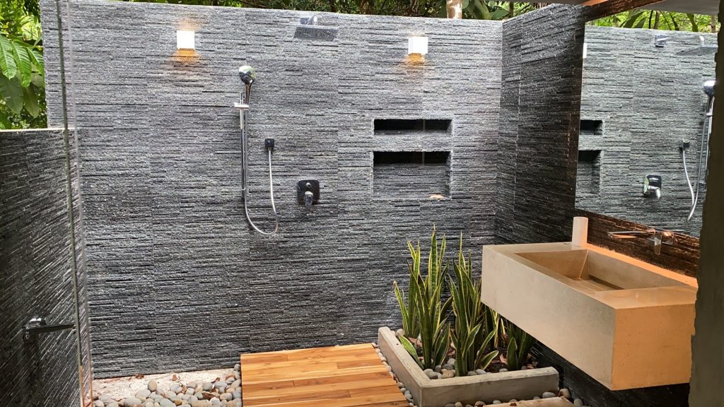 Take a refreshing outside shower after a day of tropical adventures.