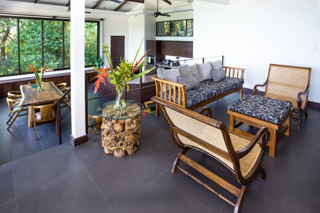 Massive glass windows and doors offer some of the best ocean views in Manuel Antonio from the sky suite great room.