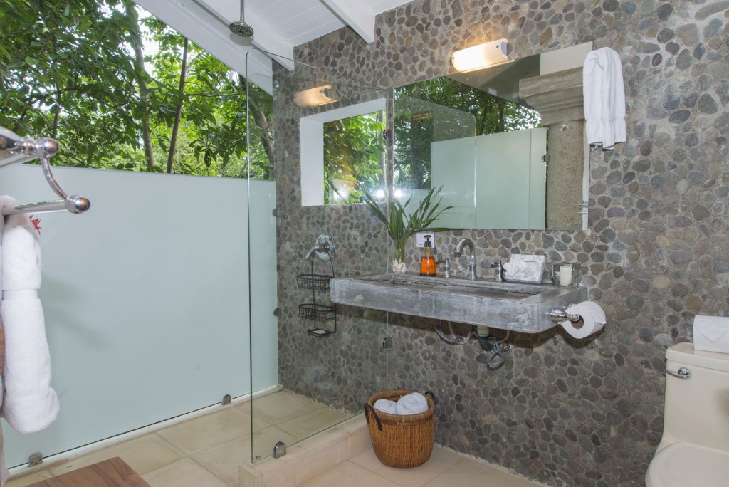 The bathroom in the separate casita is a luxurious setting and open to the tropical jungle.