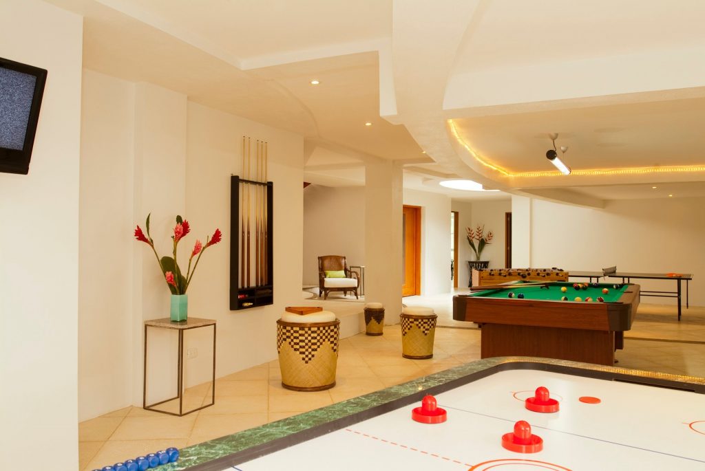 There is plenty of fun to be had in the games room below, with air hockey, foosball, and a pool table.