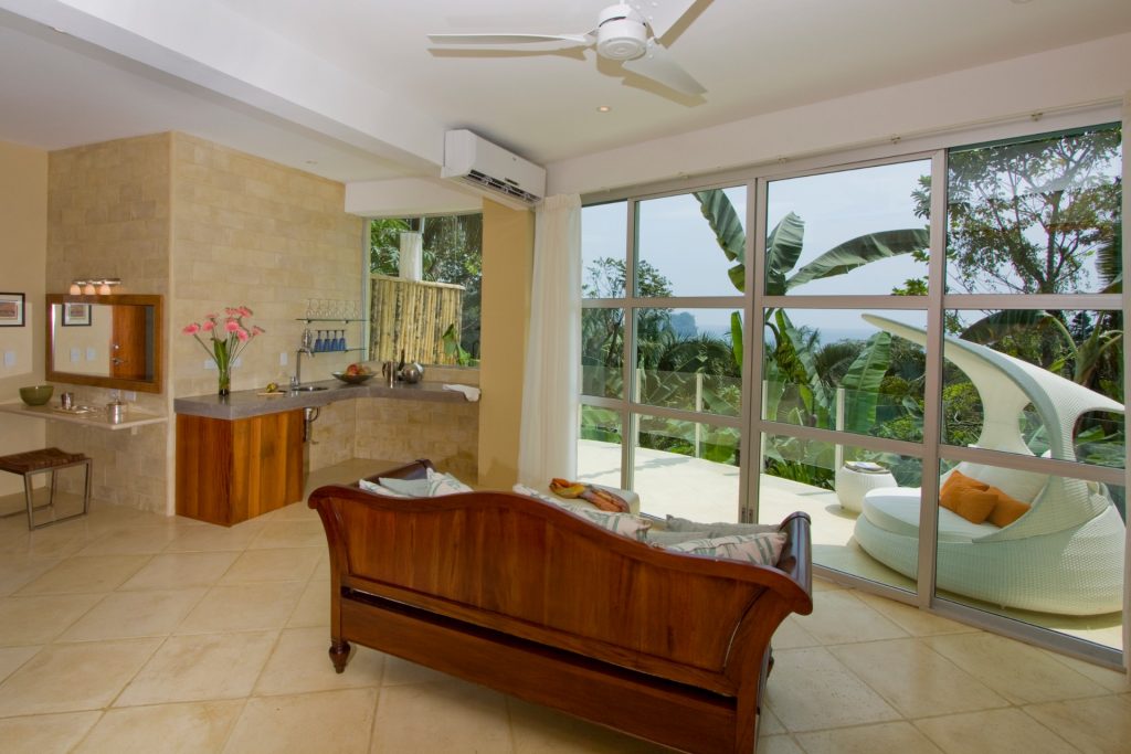 In this bedroom, open up the sliding glass door, turn on the fan, and you will see how easy it is to enjoy paradise!